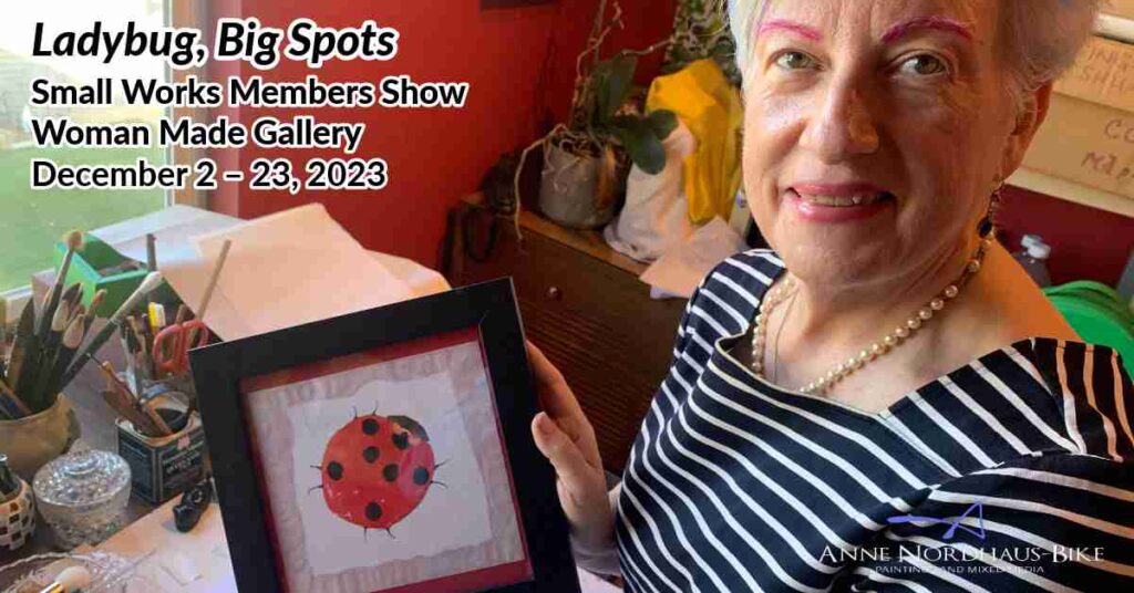 Artist Anne Nordhaus-Bike holding her framed watercolor painting, Ladybug, Big Spots