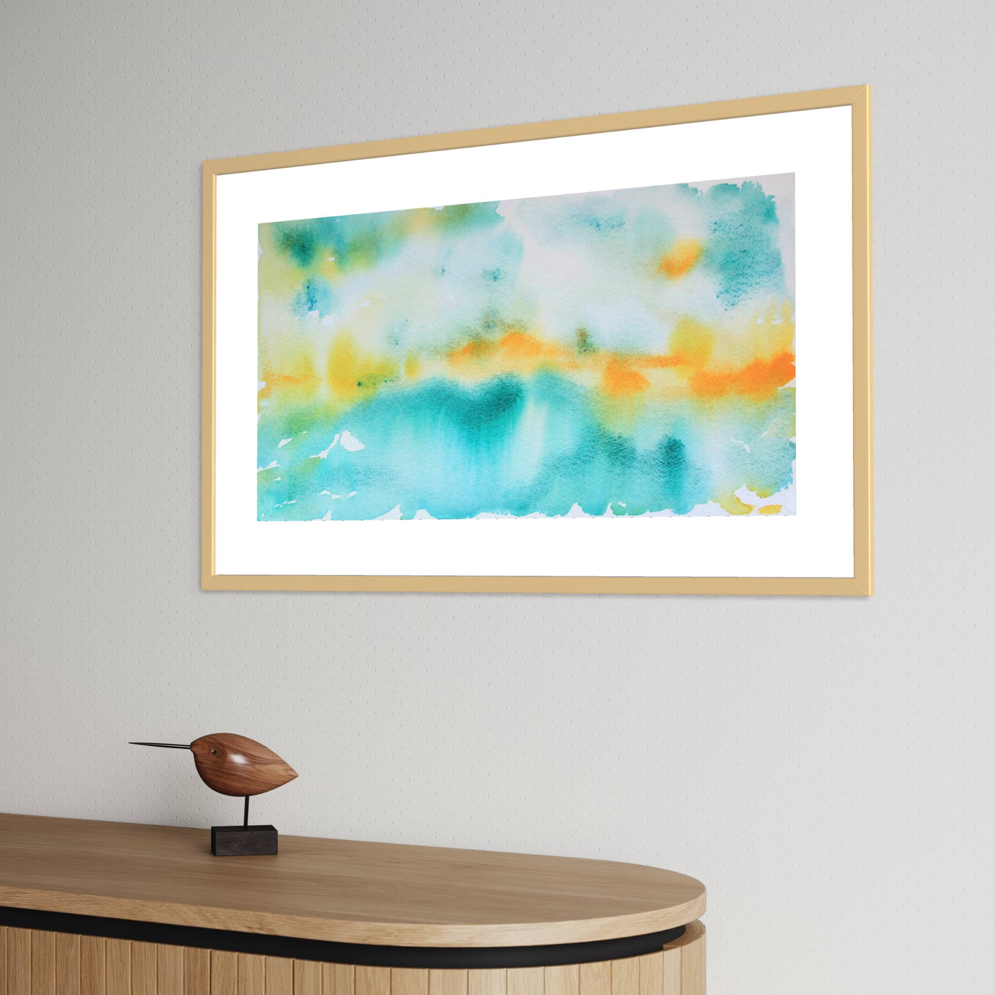 Framed green orange Breakthrough horizon landscape watercolor above wood cabinet, bird sculpture
