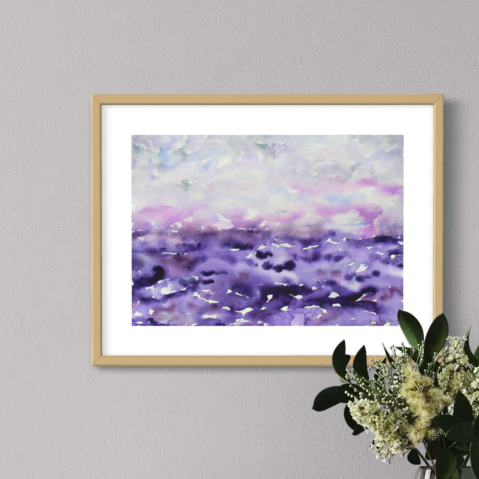 Purple and pearl gray Creation watercolor, light wood framed, gray wall, closeup view