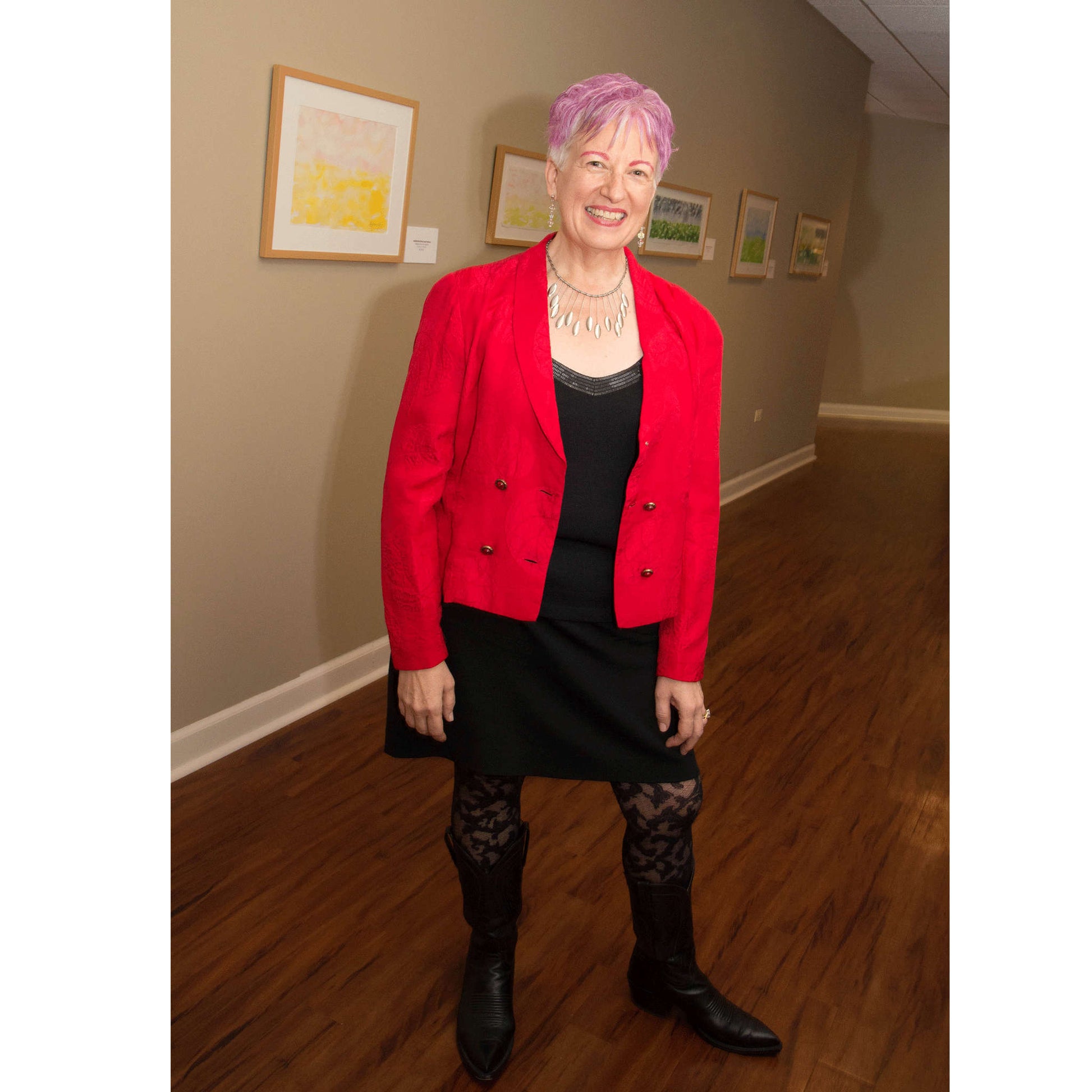 Artist Anne Nordhaus-Bike in red jacket with pink and yellow dawn horizon watercolor painting