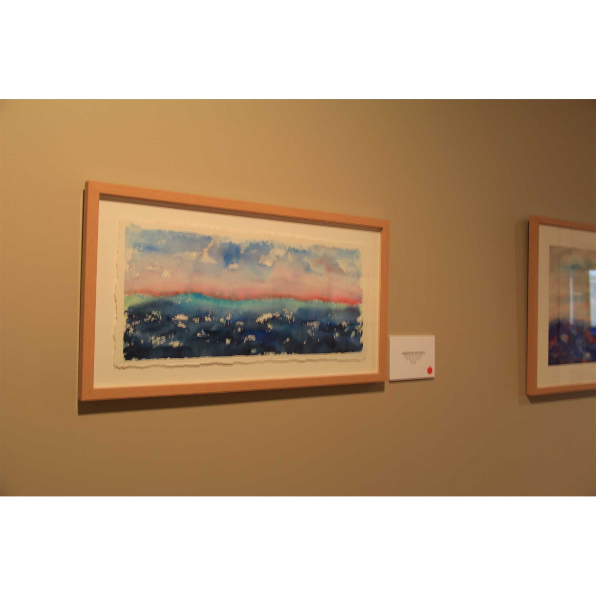 Dawning blue and pink Horizon watercolor on display at art exhibition
