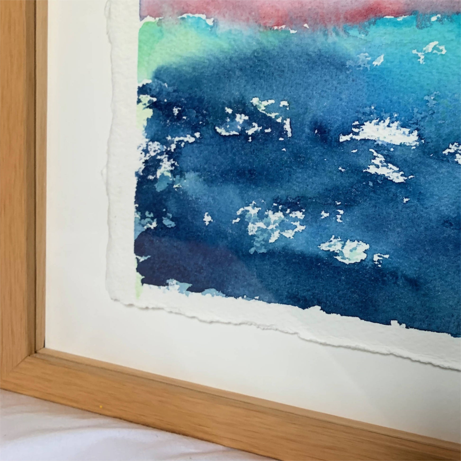 Dawning pink dark blue horizon landscape watercolor painting, lower left detail, float framing