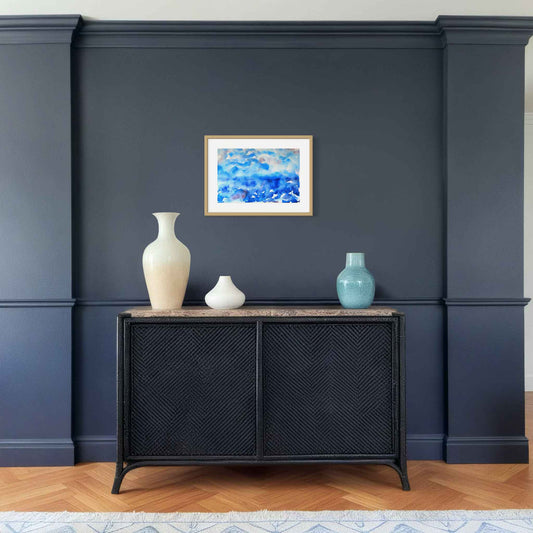 Deep Mystery dark blue, red framed horizon watercolor, deep blue wall above console table