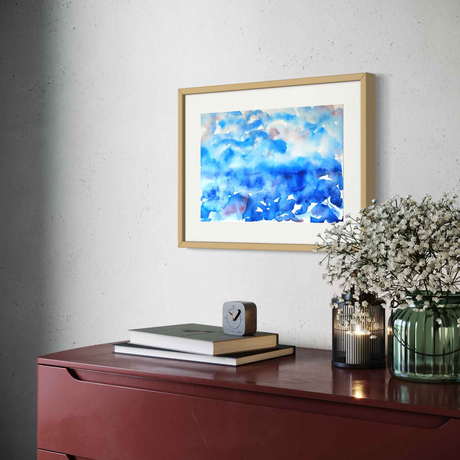 Deep Mystery horizon watercolor, deep blues with red, angled view above cherry wood credenza