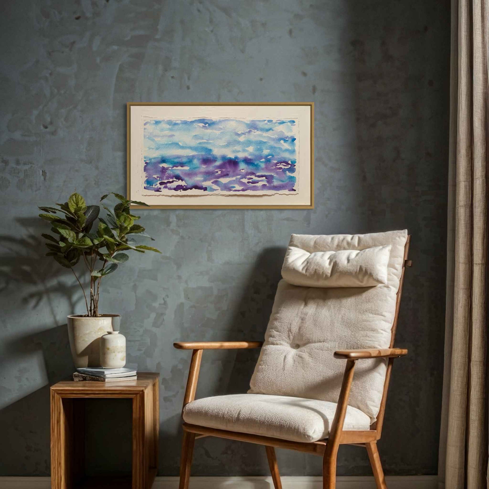 Getting Ready blue purple horizon watercolor painting on gray wall with modern easy chair, table