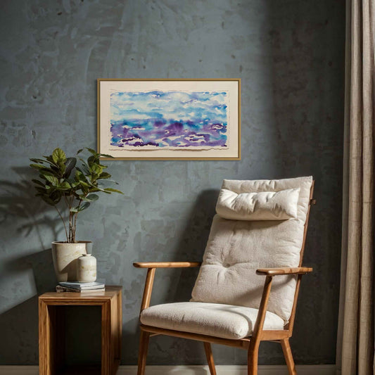 Getting Ready blue purple horizon watercolor painting on gray wall with modern easy chair, table