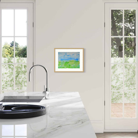 Opening Sky blue, leaf green horizon watercolor, framed, white kitchen wall between french doors
