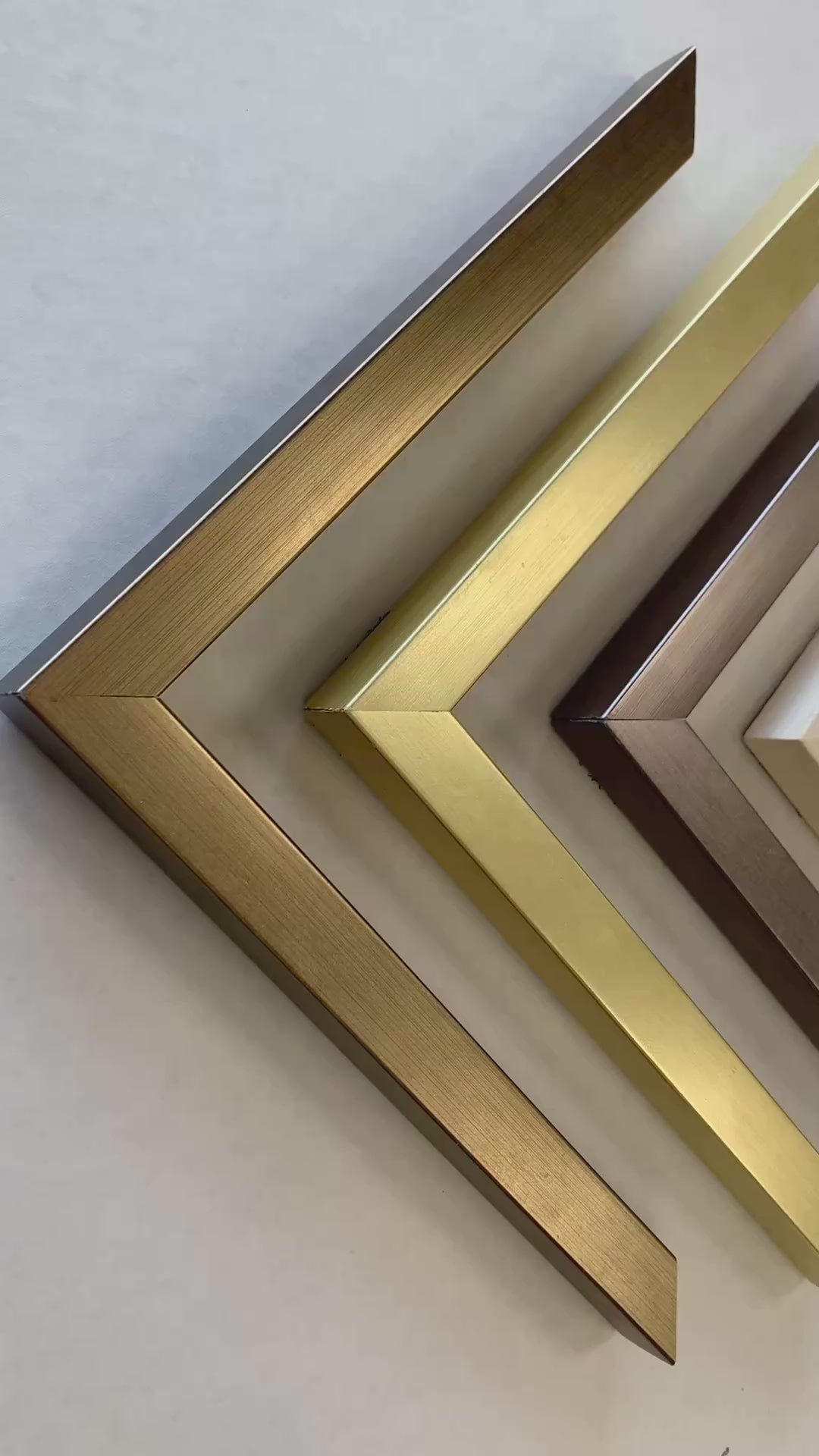 Product video showing ten frames for watercolor paintings, V-shaped frame corners, sideways view