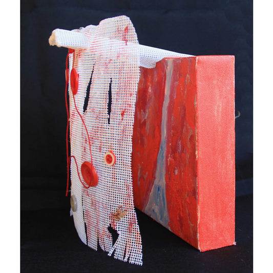 Artist Anne Nordhaus-Bike's mixed media piece Red Coat Remembered, closeup angled view