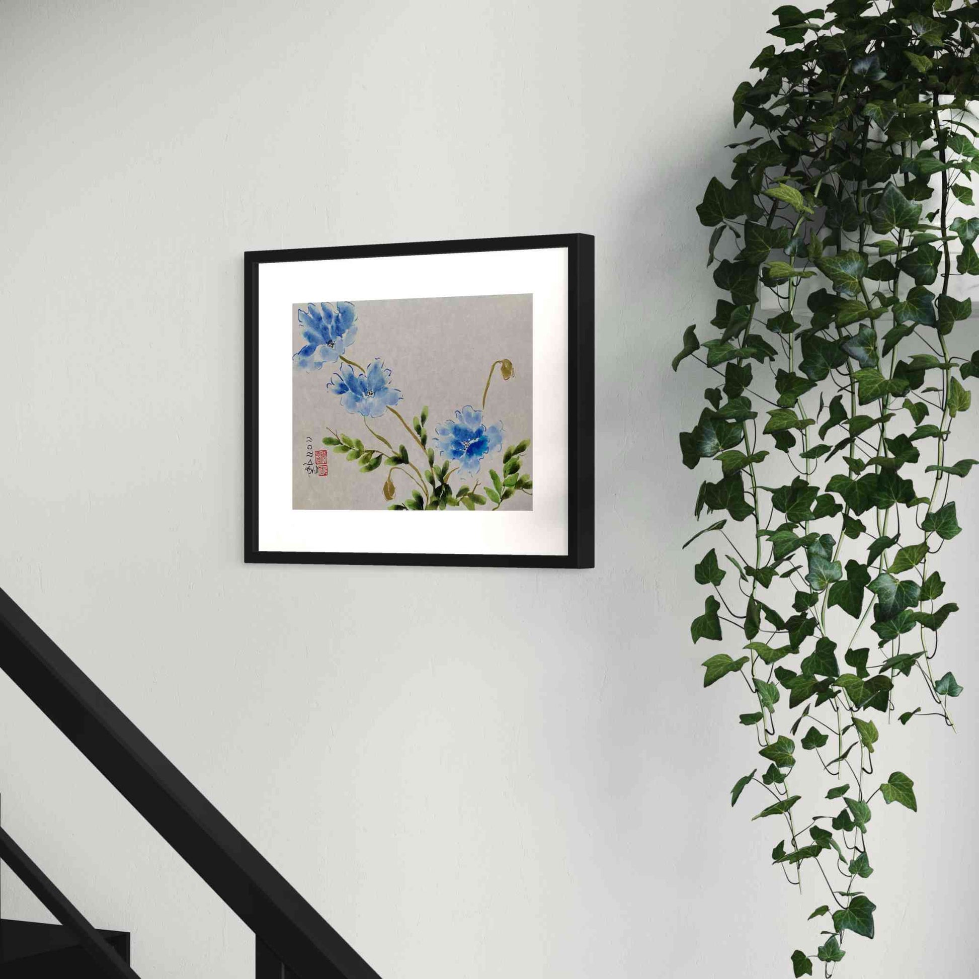 Three blue flowers watercolor painting on stairway wall, next to plant, closeup angled view