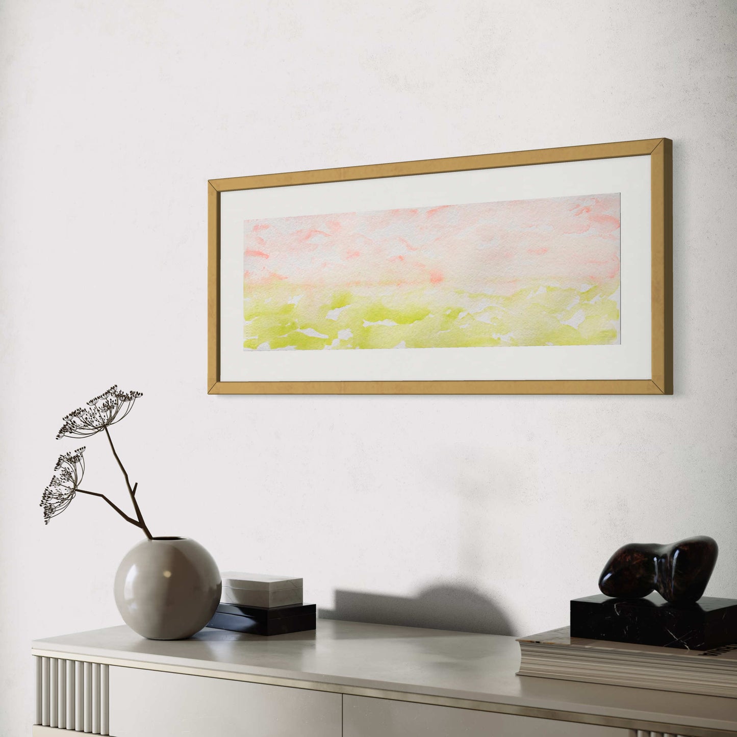 Framed Spring Morning leaf green, pink horizon watercolor above light gray credenza/cabinet